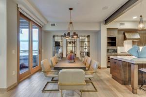 a kitchen and dining room with a table and chairs at Premium Two Bedroom apartment hotel in Park City +1 photo