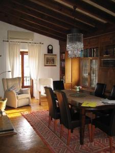 a living room with a dining room table and chairs at Villa Sa Capsana in Valldemossa