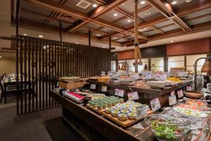 a buffet line with many different types of food at Arima Onsen Gekkoen Yugetsusanso in Kobe