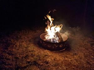 a pot of fire with flames in it at Tentrr Signature Site - Greener Acres Roan Mountain View in Roan Mountain