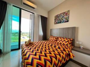 a bedroom with a bed and a large window at Private Condo Port Dickson Waterfront in Port Dickson