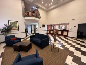 a lobby with couches and chairs and a table at Comfort Suites Bluffton-Hilton Head Island in Bluffton