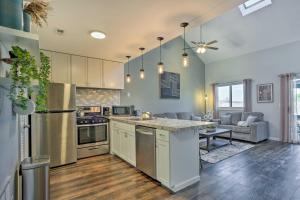 a kitchen with an island in the middle of a room at Vernon Township Condo - Walk to Ski Resort! in Vernon Township