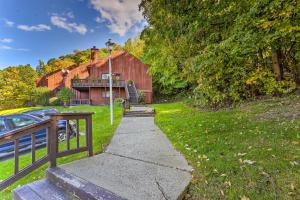 a driveway leading up to a barn with a house at Vernon Township Condo - Walk to Ski Resort! in Vernon Township