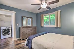 a bedroom with a bed and a ceiling fan at Vernon Township Condo - Walk to Ski Resort! in Vernon Township