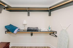 a room with a shelf on the wall at Uptown Charlotte 2BR Furnished Apartments apts in Charlotte