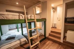 a bunk bed room with two bunk beds at GRAND CAVE MOTOMACHI in Yokohama