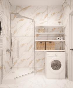 ein Bad mit einer Dusche und einer Waschmaschine in der Unterkunft Дизайнерська сучасна квартира in Luzk