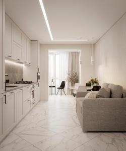 ein weißes Wohnzimmer mit einem Sofa und einer Küche in der Unterkunft Дизайнерська сучасна квартира in Luzk