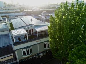 an aerial view of a building with a tree at Laneway Apartments in Napier