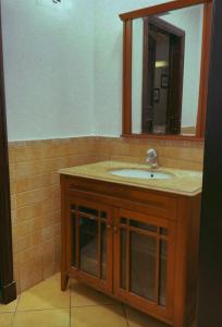 a bathroom with a sink and a mirror at درة العروس - فيلا الحلم Dream 4u in Durat Alarous