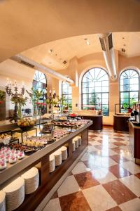 a buffet line with a lot of food on display at The Scots Hotel in Tiberias