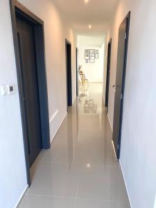 a hallway with two doors leading to a room at Park Rezort with Parking & Air conditioning in Piešťany +7 photos