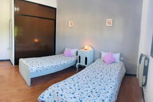 A bed or beds in a room at Encantador departamento en Capital Federal con patio