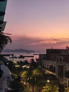 a view of the city at sunset at Lea House Ha Long in Ha Long