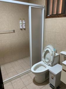 a bathroom with a shower stall and a toilet at Yamaharuka in Jinhu +38 photos