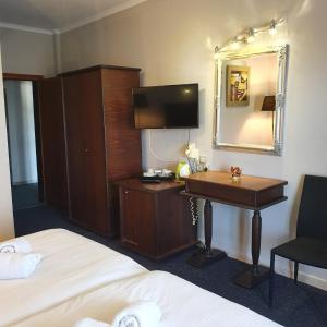 A bed or beds in a room at Liknon