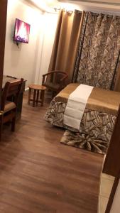 Кровать или кровати в номере Hellenis Guest House