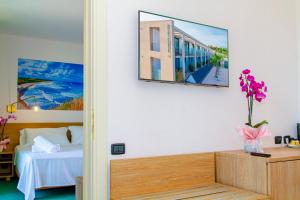 Postel nebo postele na pokoji v ubytování Residence al Palace