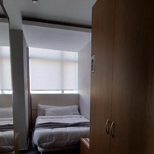 Postel nebo postele na pokoji v ubytování El Ghanami Hotel
