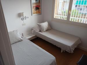 Letto o letti in una camera di Cambrils Pi Rodó