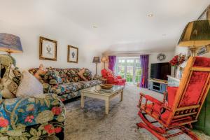 a living room with a couch and a chair at Armando in Truro