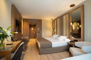 Postel nebo postele na pokoji v ubytování Hotel Granada Center