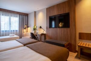 Postel nebo postele na pokoji v ubytování Hotel Granada Center