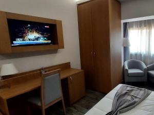 TV a/nebo společenská místnost v ubytování El Ghanami Hotel