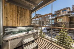 a large balcony with a hot tub on it at Platinum Four Bedroom Suite apartment hotel in Park City