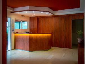 a lobby with a counter in a room with wood at Tivoli in Athens