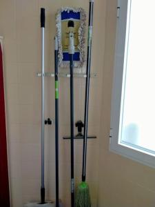 a group of three mop poles in a room at Zona CENTRO-Parking GRATUITO in Castellón de la Plana +44 photos