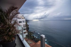 a view of the ocean from a balcony of a building at Cozy Studio with fantastic Sea View in Los Realejos