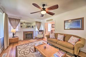 a living room with a couch and a ceiling fan at Convenient Jacksonville Home with Yard and Patio! in Jacksonville
