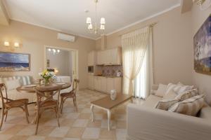 a living room with a couch and a table at Ionia Suites in Rethymno Town