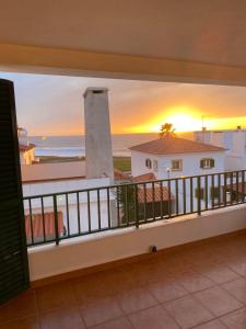 a balcony with a view of the ocean at Villa Kethellen in Porto Covo