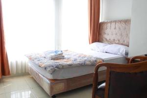 Letto o letti in una camera di Brahma Hotel Mitra RedDoorz