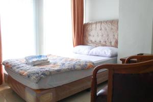 Letto o letti in una camera di Brahma Hotel Mitra RedDoorz