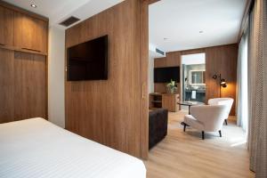 TV a/nebo společenská místnost v ubytování Hotel Granada Center