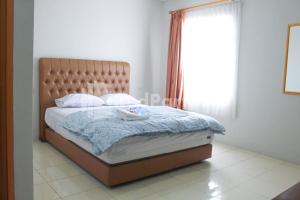 Letto o letti in una camera di Brahma Hotel Mitra RedDoorz
