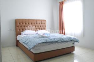 Letto o letti in una camera di Brahma Hotel Mitra RedDoorz