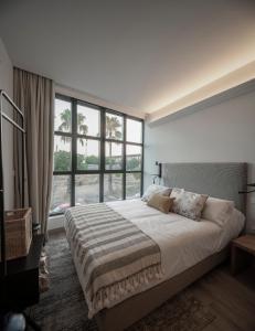 Posteľ alebo postele v izbe v ubytovaní Apartamentos Rosa Velázquez