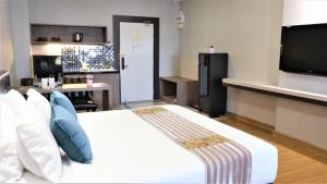 Voodi või voodid majutusasutuse KTK Pattaya Hotel & Residence toas