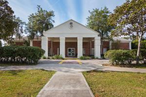 a red brick building with a white at Motel 6-Ocala, FL - Conference Center in Ocala Ridge