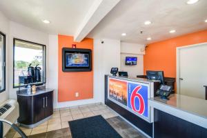 a video game room with a large screen television at Motel 6-Schiller Park, IL - Chicago O'Hare in Schiller Park