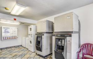 a kitchen with refrigerators and appliances in a room at Motel 6-Medford, OR - North in Medford