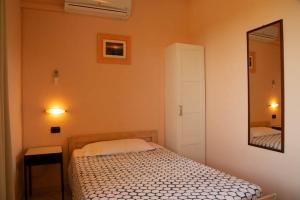 Postel nebo postele na pokoji v ubytování La Quercia Hotel con Ristorante