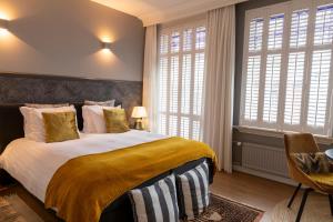 Postel nebo postele na pokoji v ubytování Guesthouse Thoez