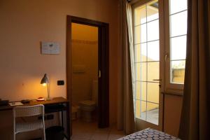 Postel nebo postele na pokoji v ubytování La Quercia Hotel con Ristorante