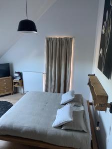Postel nebo postele na pokoji v ubytování Hors-Champs